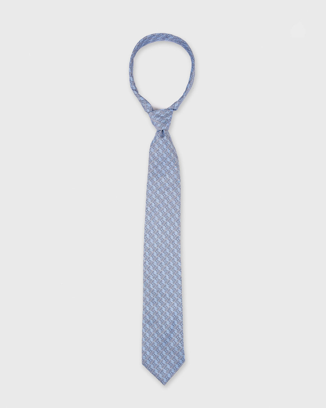 Blue patterned tie on a white background