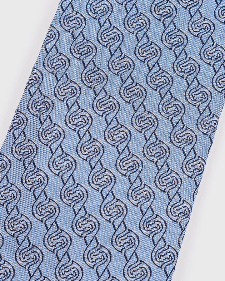 Blue tie with a pattern of interlocking shapes on a white background